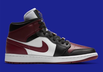 Jordan voegt een dosis goud toe aan deze nieuwe Jordan 1 Mid "Maroon"