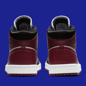 Jordan voegt een dosis goud toe aan deze nieuwe Jordan 1 Mid "Maroon"