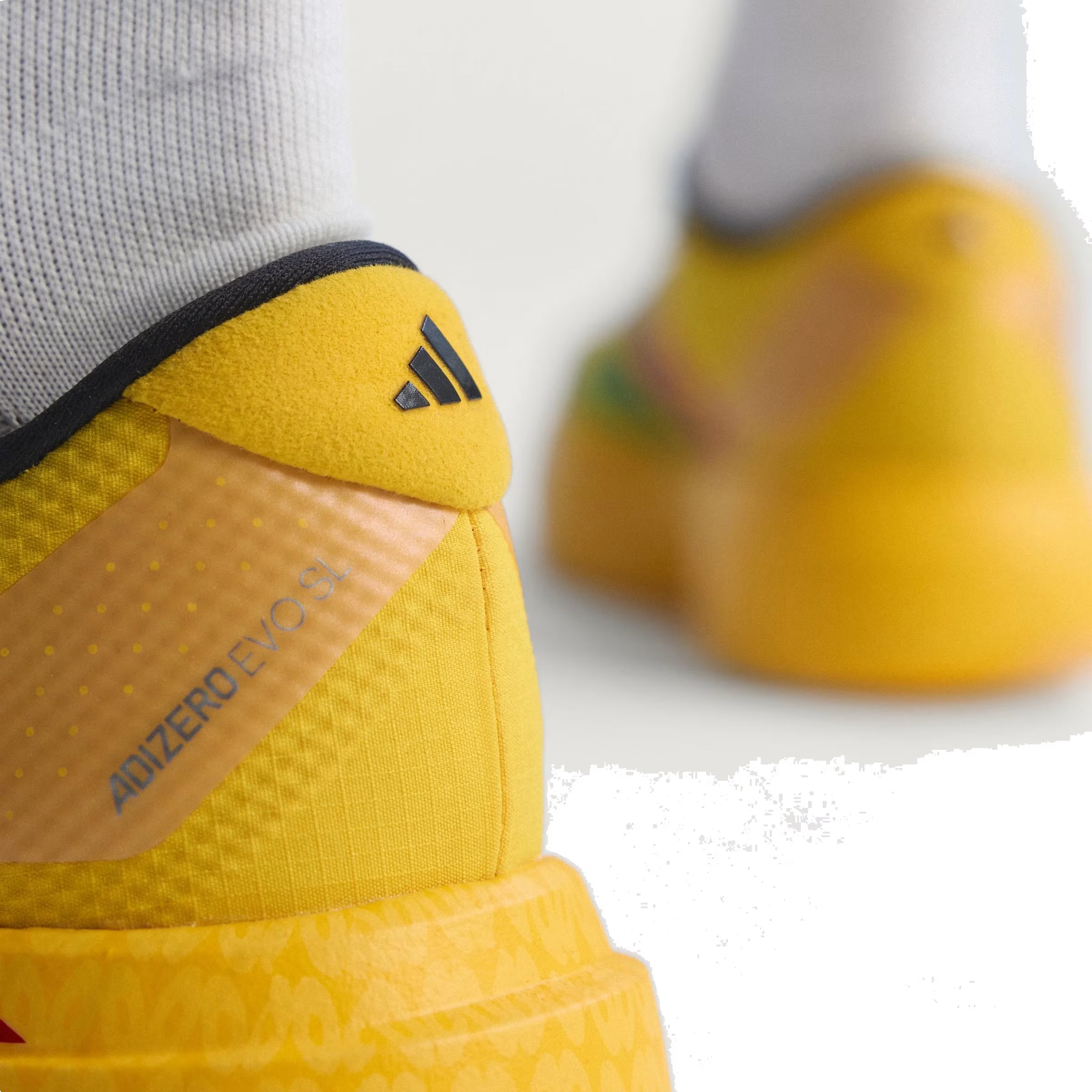 Bob Marley x Adidas Adizero Evo SL "Bold Gold"